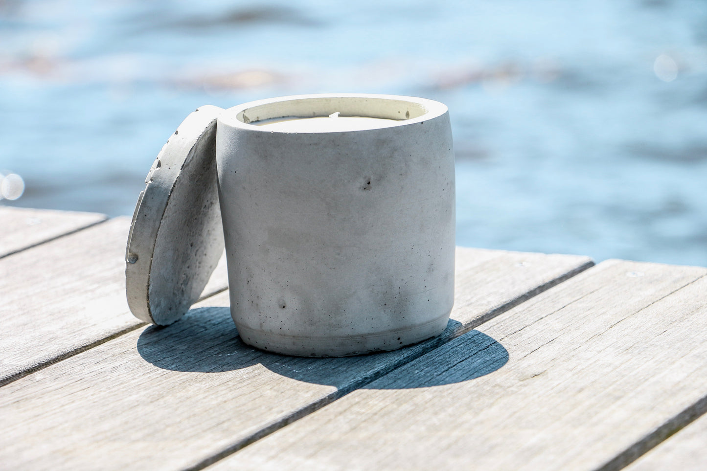 soy candle in cement vessel